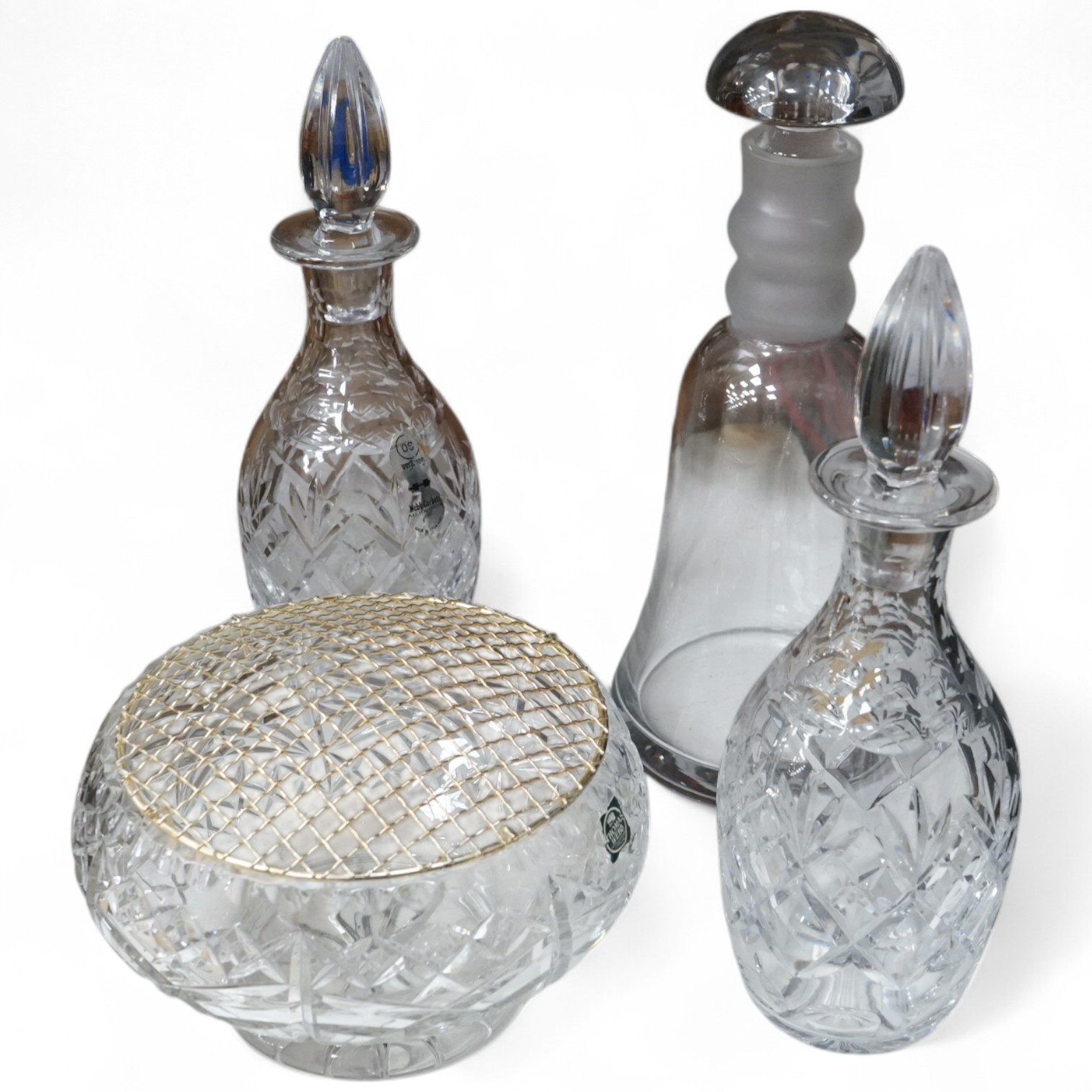 A Webb Corbett bowl, two decanters and another decanter, largest 30cm high